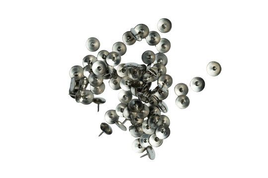 Scattered metal thumb tacks on transparent background

