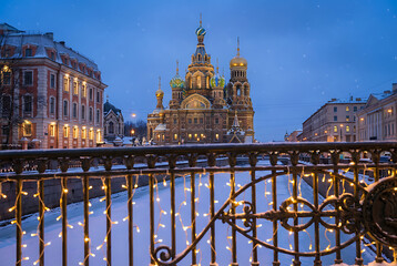 Saint Petersburg Christmas. Russia winter. Church Savior on Spilled Blood on winter evening. Panorama of Petersburg. Winter urban landscape of Saint Petersburg. Neva River is frozen. Russia new year