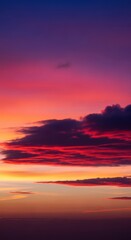 A serene and colorful evening sky displaying deep gradients of indigo and crimson. Dramatic cloud structures catching the last remnants of fading daylight, atmosphere, outdoor, orange