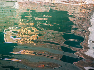 Water, sun, and reflections as abstract artists.