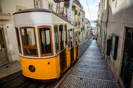Yellow funicular tram car of the Elevador da Bica in Lisbon, Portugal