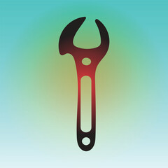 Red and black wrench tool on a green background for construction work