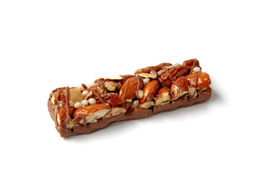 sweet caramel nut bars with chocolate isolated on white background.