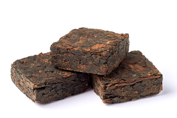 Black pu-erh Chinese tea. Pressed tiles of fermented black tea isolated on white background.