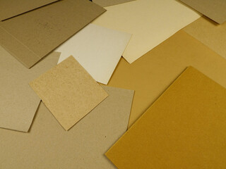 Different types of cardboard for the production items for storing and transporting various items, top view, background
