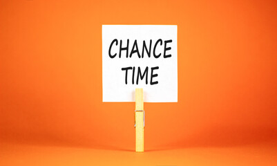 Chance time symbol. Concept word Chance time on beautiful white paper. Beautiful wooden clothespin. Beautiful orange background. Business chance time concept. Copy space.
