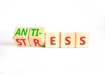 Anti stress symbol. Concept words Anti stress or Anti-stress on beautiful wooden cubes. Beautiful white background. Business, psychological anti stress concept. Copy space.
