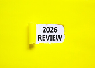 2026 Review symbol. Concept words 2026 Review on beautiful white paper. Beautiful yellow paper background. Business and 2026 review concept. Copy space.