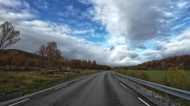 Driving through the autumn landscape of Norway towards Nordkapp