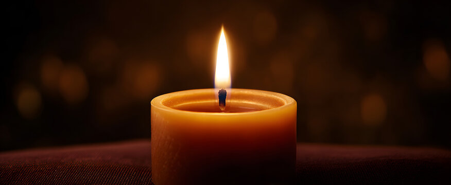 The calm light of a candle used for meditation close-up vibe