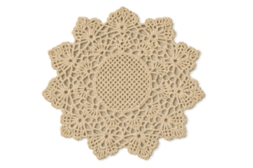 Intricate beige crocheted doily isolated on transparent background, handmade lace.