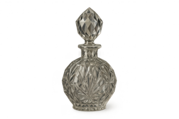 Elegant faceted glass decanter with stopper isolated on transparent background
