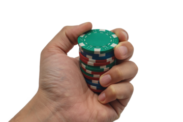 A hand grips a tall stack of colorful poker chips, featuring green, blue, and red tokens, ready for a game. background removed