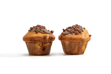 Two chocolate-topped muffins stand side by side on a white background. Clean studio lighting and gentle shadows for product or menu design.