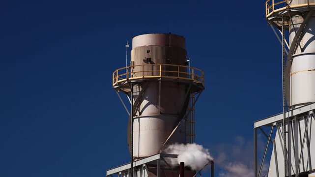 Electricity energy power plant engine and emission at chemical refinery petrochemical industry plant in industrial structure. Technician engineer produce gas gasoline and chemical production business