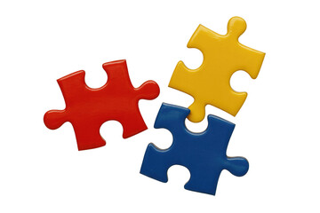 Obraz premium Three brightly colored puzzle pieces (red, yellow, blue) are arranged closely, symbolizing connection, solution, and teamwork on a solid transparent background. background removed