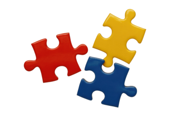 Three brightly colored puzzle pieces (red, yellow, blue) are arranged closely, symbolizing connection, solution, and teamwork on a solid transparent background. background removed