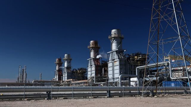 Electricity energy power plant engine and emission at chemical refinery petrochemical industry plant in industrial structure. Technician engineer produce gas gasoline and chemical production business