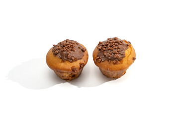 Two muffins with chocolate frosting and sprinkles photographed from above on white. Minimal composition with soft shadows and ample copy space.