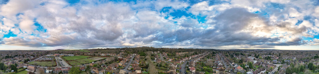 Fototapeta premium Aerial Drone Camera View of British Residential Buildings and Roads with Traffic of East Luton City Streets Aerial View of England During Evening of Winter. 25th November, 2025