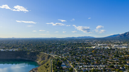 Aerial shot of the homes with lush green trees at sunset in Duarte California USA