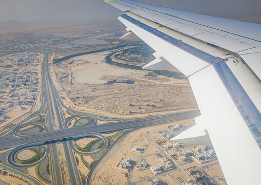 Dubai from above. Plane landing in Dubai, United Arab Emirates, Dubai view from an airplane window.