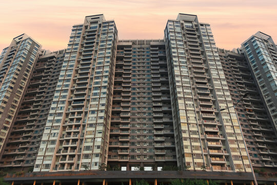 New construction of tall and massive apartment home building in new city Navi Mumbai, India.