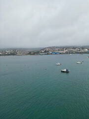 Aerial Footage of Teignmouth Beach and Ocean Town of England United Kingdom. High angle View Was Captured with Drone Camera During Windy and Rainy clouds over British Tourist Attraction of England UK