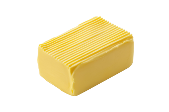 A golden block of butter, clearly defined with textured ridges on top, presented against a clean, plain background for versatile use. background removed