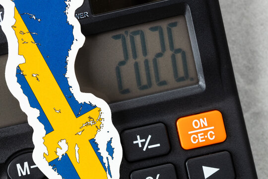 Sweden, 2026. Economic business concept. Swedish symbol on a calculator with the date 2026. Financial background. Close up