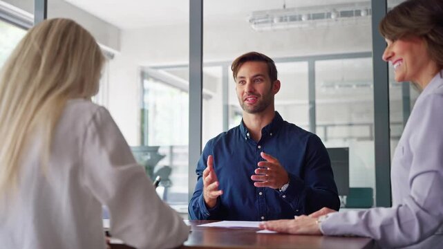 Team of happy smiling successful European people, business man and mature latin professional woman talking celebrating achieving superior performance, outcomes in work giving high five in office. 