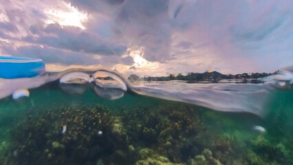 Stormy cloudscape seascape water edge on the shore of an ocean in a tropical Thailand beach