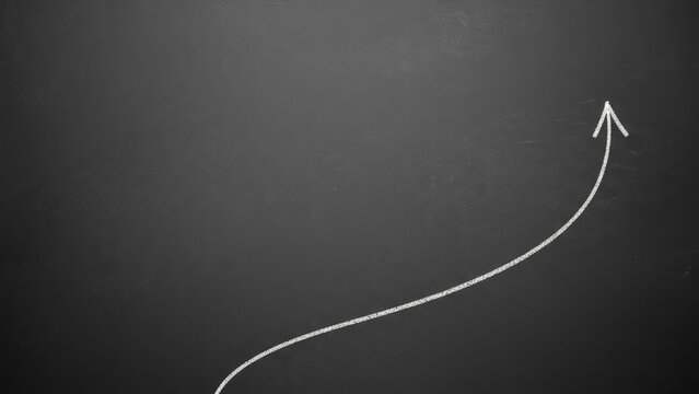 Chalkboard with a white arrow pointing up, symbolizing growth/success.