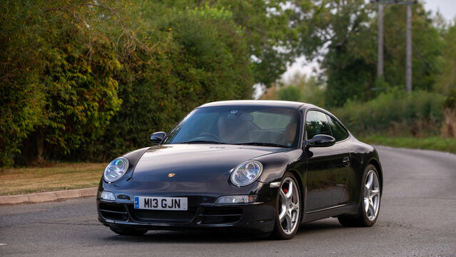 Whittlebury,Norhants,UK - Aug 23rd 2025: 2005 black Porsche 911  car driving on a British road