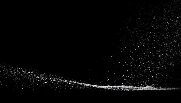 Black seamless background featuring scattered white dust particles illuminated by soft light from above, creating a mysterious, atmospheric effect suitable for photography, design, digital art, presen