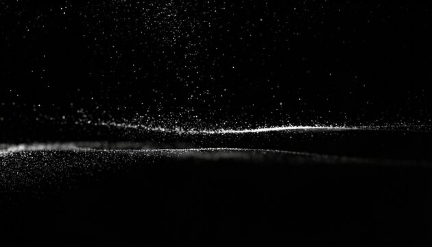 Black seamless background featuring scattered white dust particles illuminated by soft light from above, creating a mysterious, atmospheric effect suitable for photography, design, digital art, presen