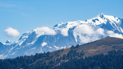 Alpine landscape showing the snow-covered west face of the Mont Blanc, the highest mountain in Europe, photographed during hiking around the Aravis Pass in the French Alps.