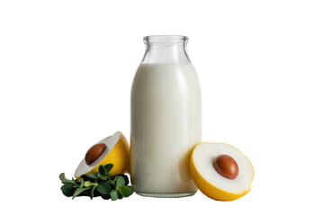Clear bottle of milk next to halved yellow fruit with seeds and fresh green leaves, presenting a healthy, natural composition. background removed