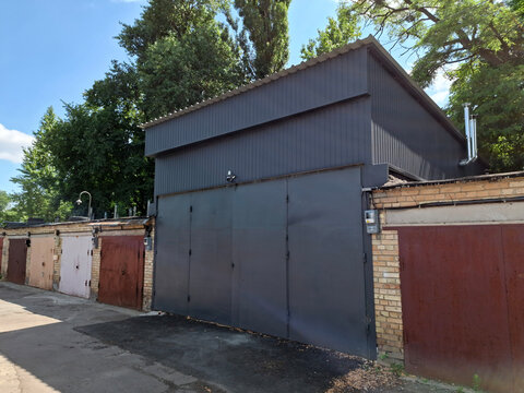 The service station has large metal doors. Premises for a car service station