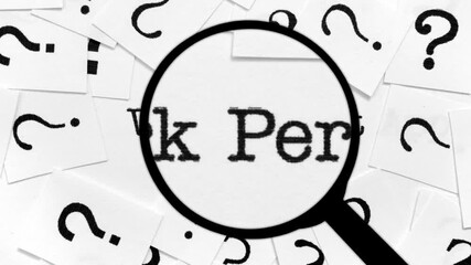 Magnifying Glass Searching for Work Permit Among Question Marks and Words