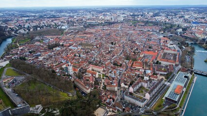 Aerial panorama view of the old town in the city Besancon in France on a cloudy afternoon in early spring.