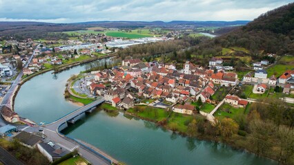 Aerial panorama view of the old town in the city Pays-de-Clerval in France on a cloudy afternoon in early spring.