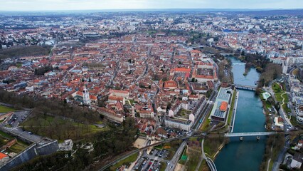 Aerial panorama view of the old town in the city Besancon in France on a cloudy afternoon in early spring.