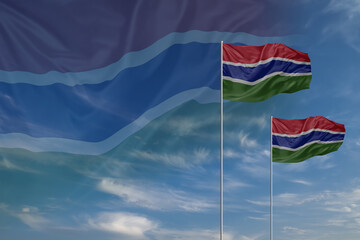 Card for Independence day National flags of Gambia waving in sky
