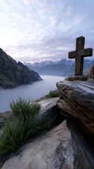 A small cross carved into a rocky cliff, surrounded by misty mountains at dawn. 