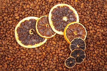 A vibrant close-up of dried orange slices nestled among roasted coffee beans, creating a warm, aromatic fusion of citrus and coffee textures. coffee aroma and taste descriptors