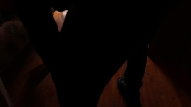 People clean up after a drone exploded near a multi-story building, causing a blast wave that blew out a window and damaged an apartment in Ukraine