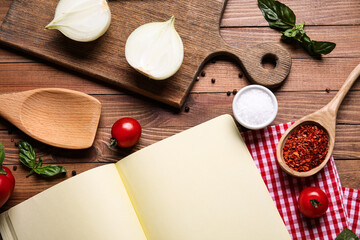 Composition with blank recipe notebook and ingredients on wooden background