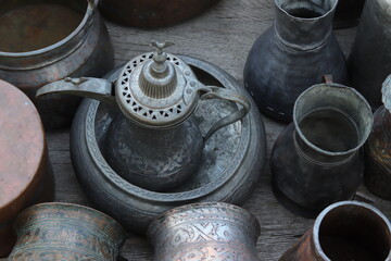 A selection of copper bowls, jugs and trays displayed at Tbilisi’s Dry Bridge flea market, capturing vintage charm and historic atmosphere.