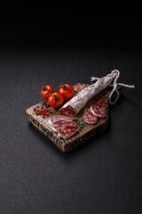 Dry Spanish salami sausage fuet as a snack for the dinner table. Fuet sausage